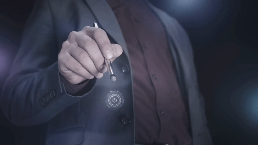 A person in a suit holds a stylus near a floating power button icon, suggesting a digital interaction.